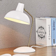 Industrial lighting shapes will never go out of style, but this table lamp gets a chic upgrade with a brass arm and multiple color options.